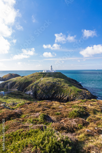 Strumble Head and Lighthouse on the west welsh coast. Copyspace above.