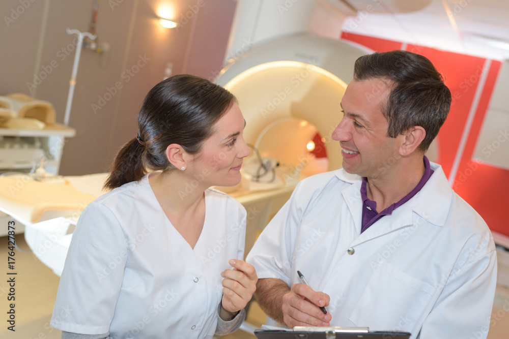 male and female doctor at a mri machine male and female doctor at a mri machine