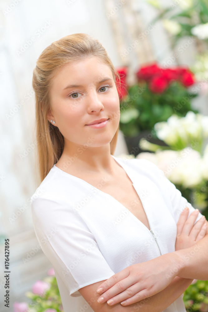 Lady with arms crossed stood in florists