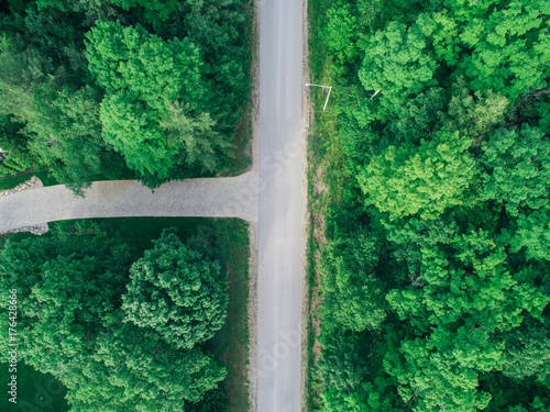 Aerial drone view of driveway and road