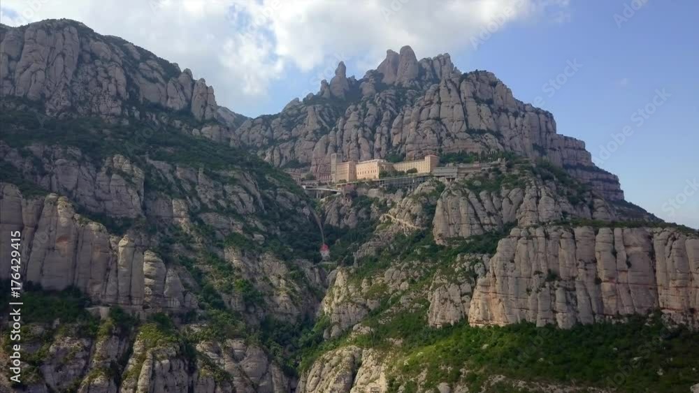Aerial view of Montserrat mountains and Gaudi-Colonia Guell Aerial view of Montserrat mountains and Gaudi-Colonia Guell