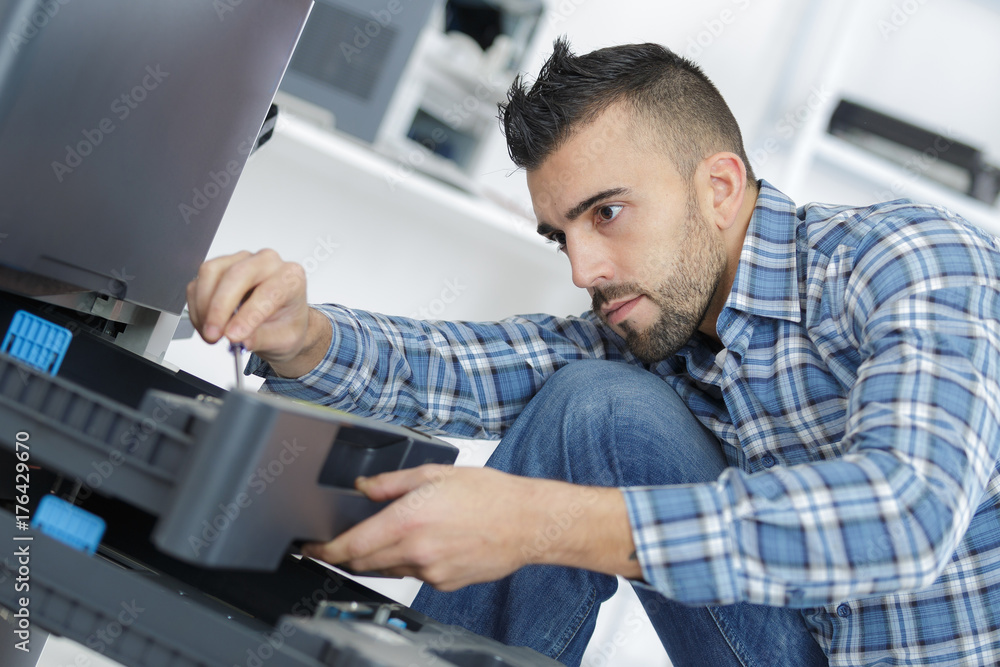 man fixing electronic circuits man fixing electronic circuits