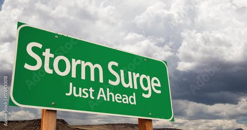 4K Time-lapse Storm Surge Green Road Sign and Stormy Cumulus Clouds and Rain. photo