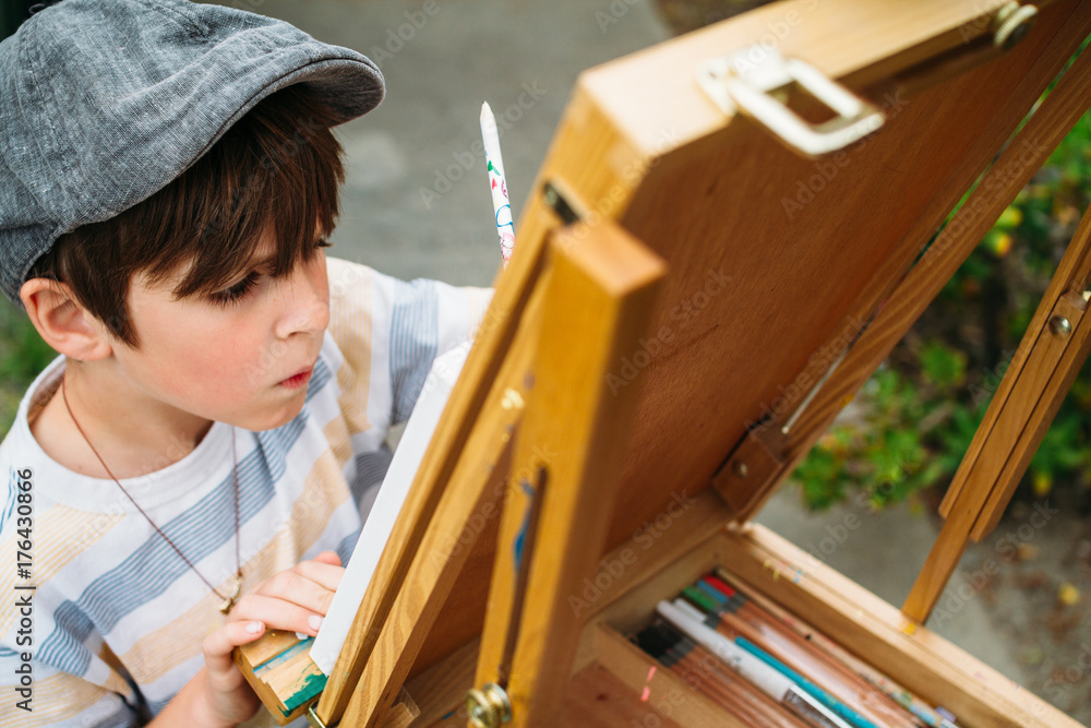 child focused on drawing he is creating child focused on drawing he is creating