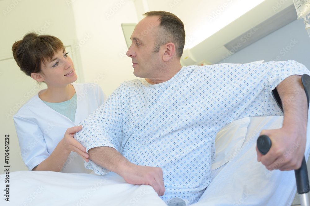friendly nurse visiting recovering patient friendly nurse visiting recovering patient