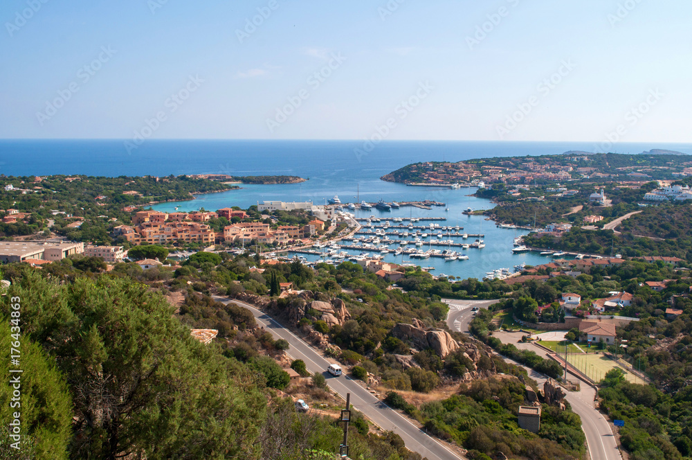 Gulf with the clear sea and the city of Porto Cervo