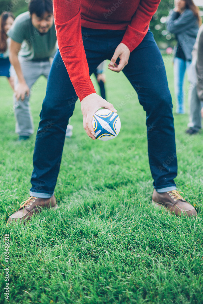 Teenagers Friends Playing Rugby in the Park Teenagers Friends Playing Rugby in the Park