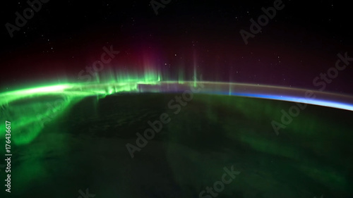 Northern lights view from space. Animation. Northern lights from the stratosphere. Northern Lights over lagoon in Iceland. Beautiful natural phenomenon Animation © Media Whale Stock