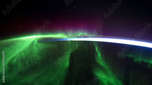 Northern lights view from space. Animation. Northern lights from the stratosphere. Northern Lights over lagoon in Iceland. Beautiful natural phenomenon Animation