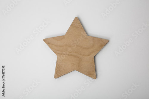 Wooden christmas star ornament on white