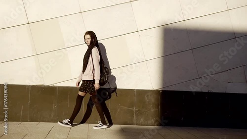 Wallpaper Mural Sideview of an urban girl walking by the building. Torontodigital.ca