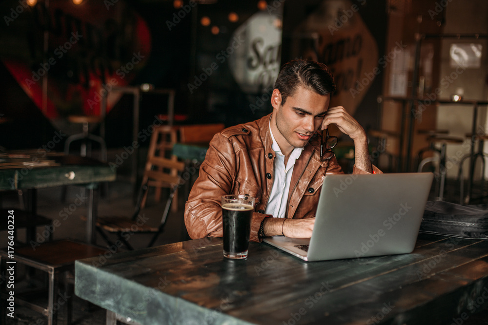 Stylish man working in a restaurant. Stylish man working in a restaurant.