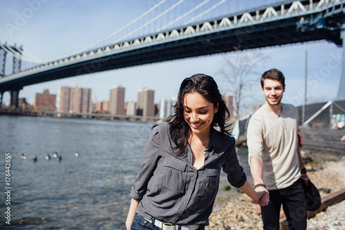 Affectionate couple walking by the river