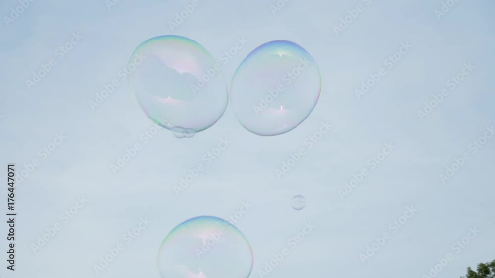 A slow motion view looking up at the large bubbles created by a nearby Central Park street vendor and entertainer. A slow motion view looking up at the large bubbles created by a nearby Central Park street vendor and entertainer.