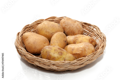 potato on basket isolated on white background