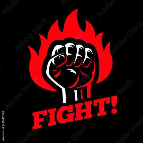 Clenched raised fist in fire on dark black background. Protest and fight strike poster symbol concept