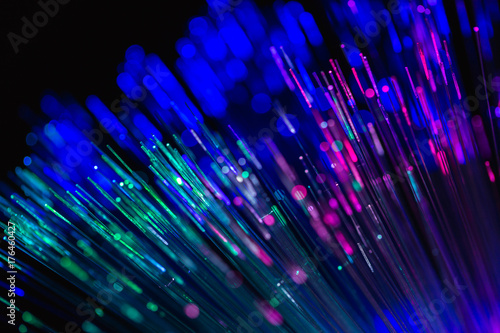 Fiber optics strands light on dark background