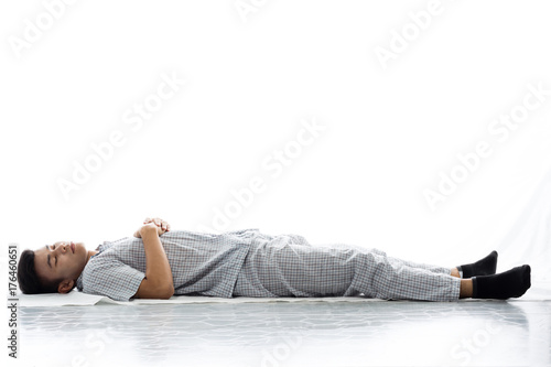 Handsome man in pajamas close up portrait studio on white background