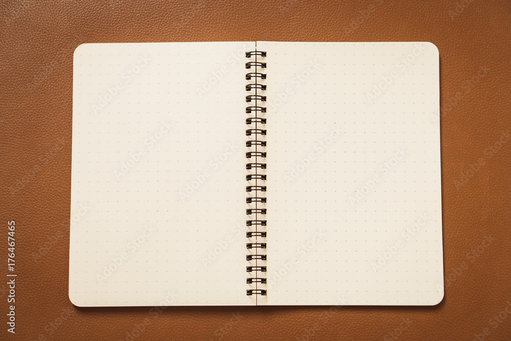 Blank paper notebook or notepad on brown background - Vintage filter Blank paper notebook or notepad on brown background - Vintage filter