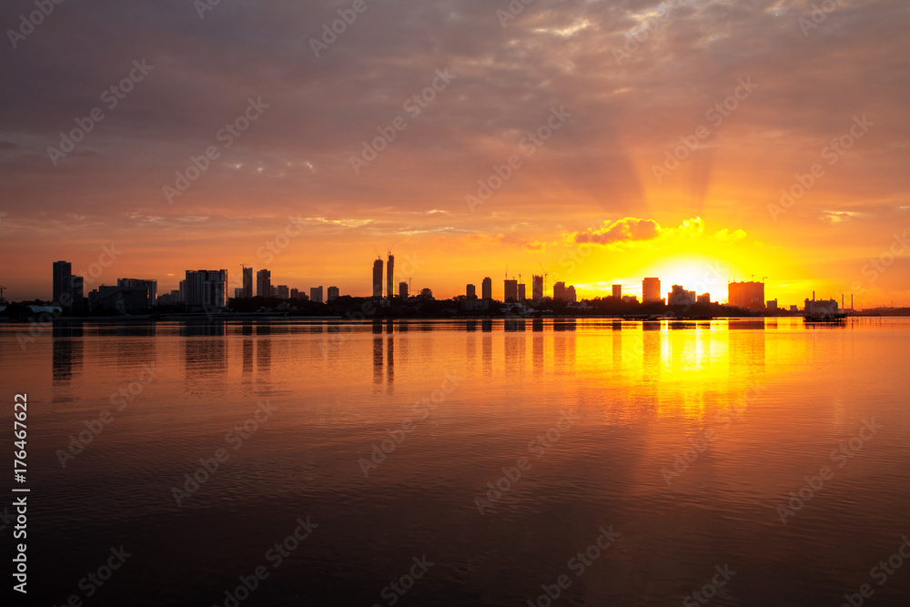 sunrise over city skyline