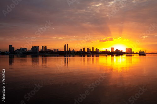 sunrise over city skyline