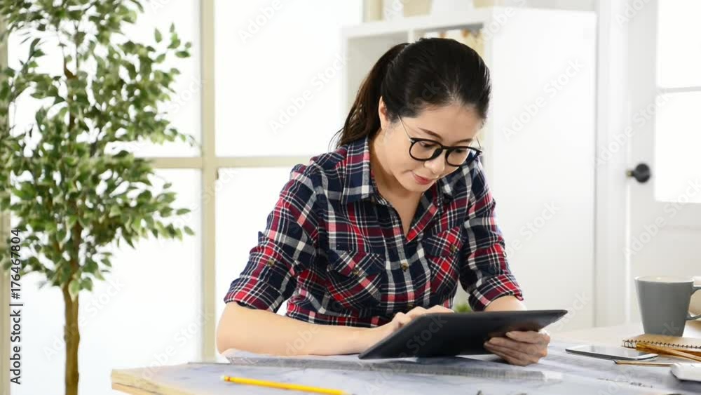 Asian female designer sketch by pencil tablet Asian female designer sketch by pencil tablet