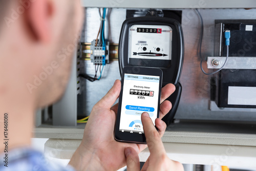 Man Reading Electric Meter photo