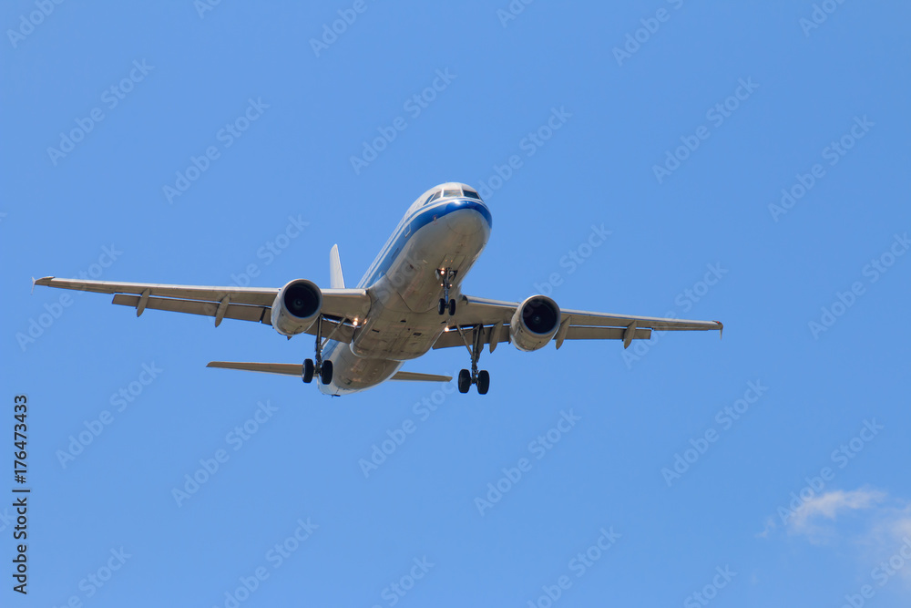 Passenger Airplane Taking Off Into The Blue Sky