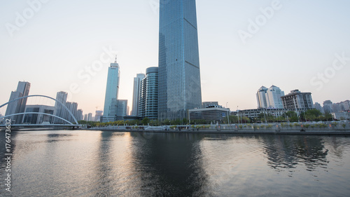 Tianjin city waterfront downtown skyline over Haihe river China.