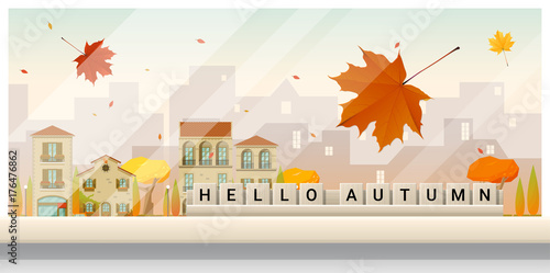 Letters spelling hello autumn on wooden table top with autumn cityscape background , vector , illustration