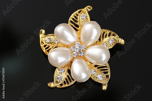 diamond and pearl on golden flower with brooch