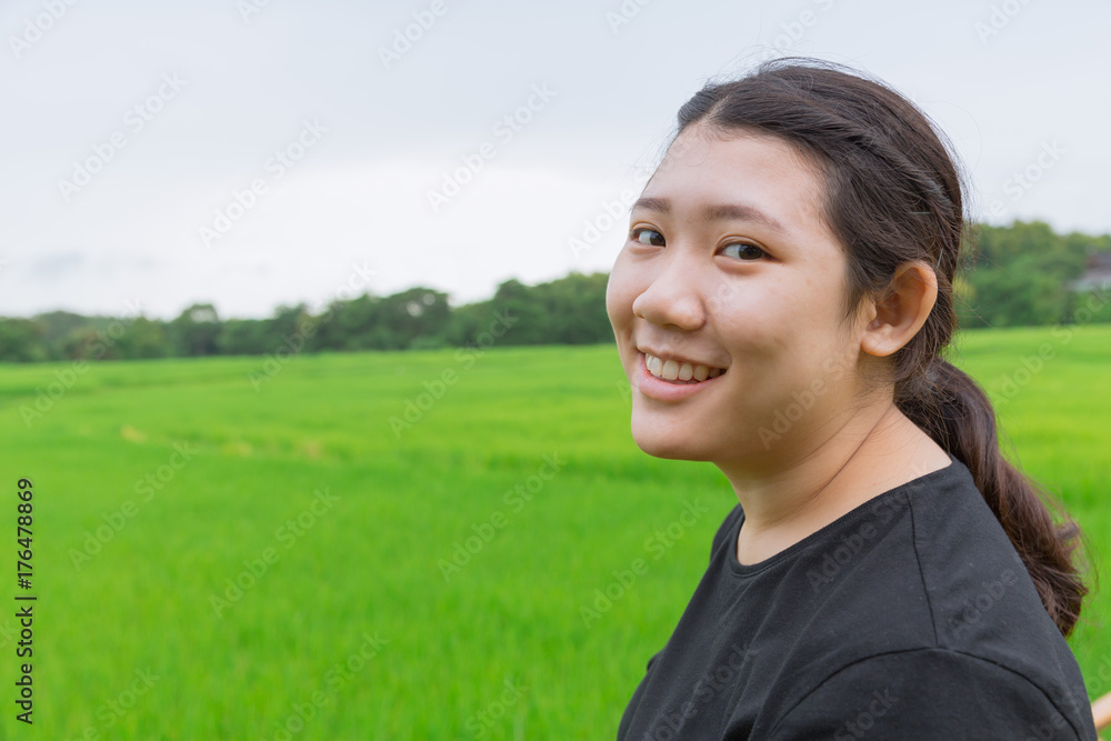 cute young innocent asian teen smile with green rice field in asian  countryside nature background Stock Photo | Adobe Stock
