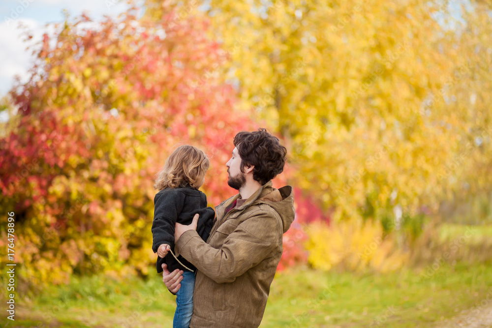 Father and daughter walking together, autumn day. Father and daughter walking together, autumn day.