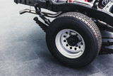 close up pickup truck rear tire with car chassis underbody clean new from factory