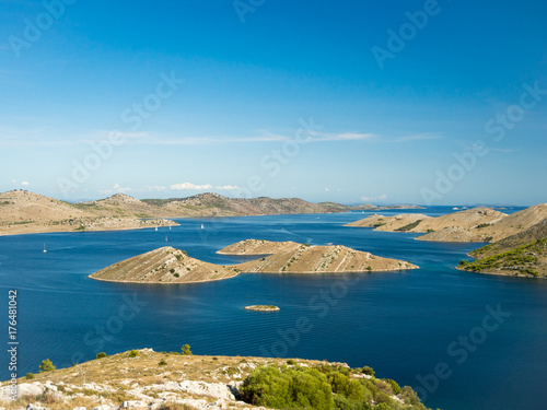 Aerial panoramic view of islands in Croatia with many sailing yachts between, Kornati national park landscape in the Mediterranean sea photo