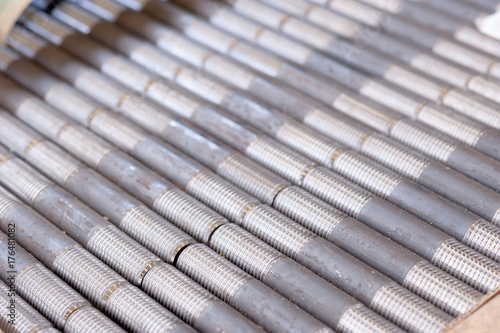 tubes with threaded threads. in production. finished parts in a row