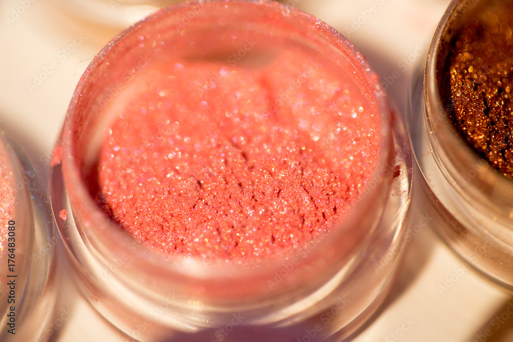 Cosmetics. Pigments for make-up, eyes, lips, face and body. Brilliant radiant, scattered multicolored powders. Cosmetics. Pigments for make-up, eyes, lips, face and body. Brilliant radiant, scattered multicolored powders.