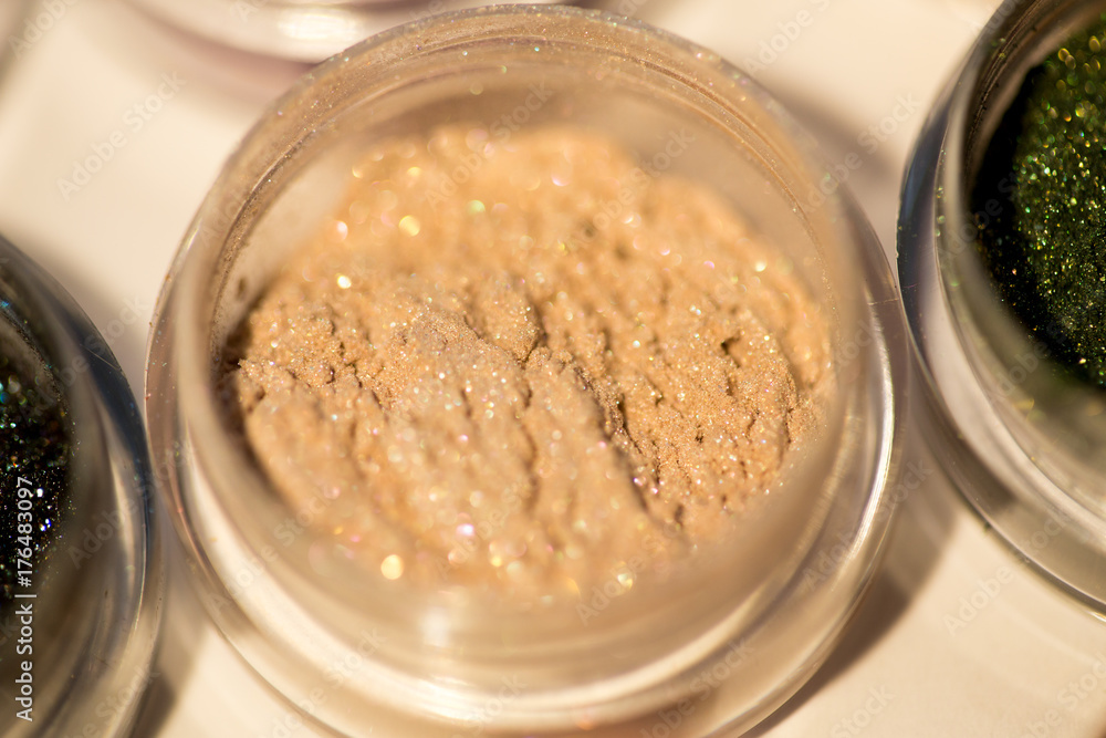 Cosmetics. Pigments for make-up, eyes, lips, face and body. Brilliant radiant, scattered multicolored powders. Cosmetics. Pigments for make-up, eyes, lips, face and body. Brilliant radiant, scattered multicolored powders.
