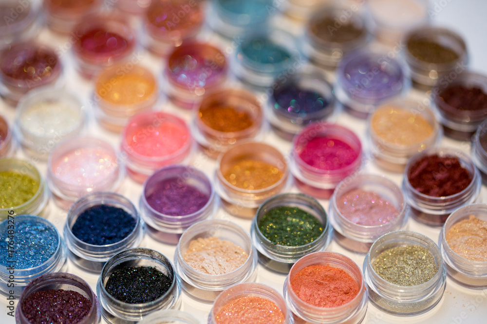 Cosmetics. Pigments for make-up, eyes, lips, face and body. Brilliant radiant, scattered multicolored powders. Cosmetics. Pigments for make-up, eyes, lips, face and body. Brilliant radiant, scattered multicolored powders.