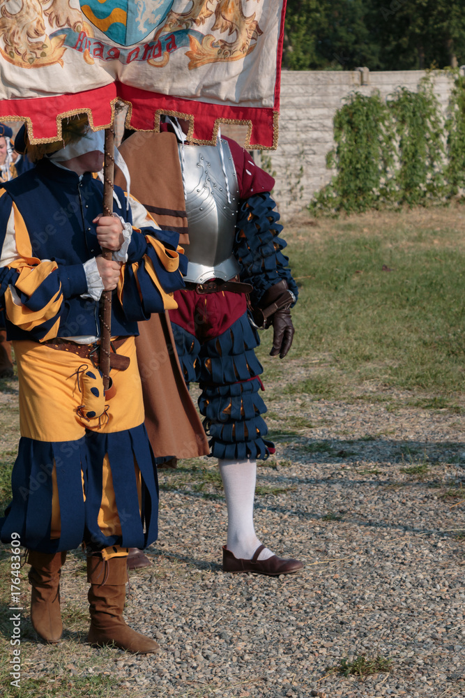 Knight and  Squire with City Standard during Parade in Historical Event Reconstruction