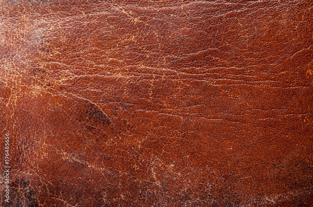 Old shabby brown leather fragment, abstract texture