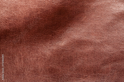 Piece of brown leather closeup shot, abstract texture