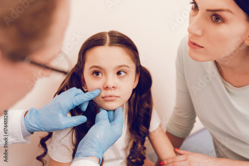 Serious longhaired kid visiting her therapist