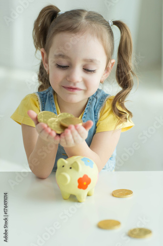 Child with a piggy bank 