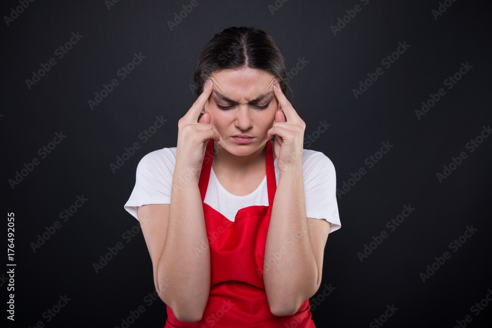 Exhausted girl seller having migraine Exhausted girl seller having migraine