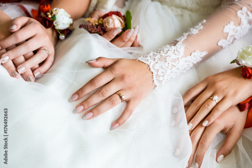 Closeup hands of the bride and bridesmaids. Closeup hands of the bride and bridesmaids.