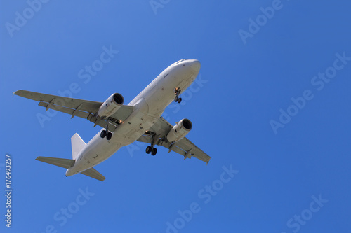 Passenger Airplane Taking Off Into The Blue Sky