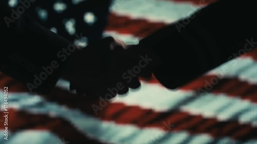 Funy Handshake. Multiple takes. USA flag on LED background.