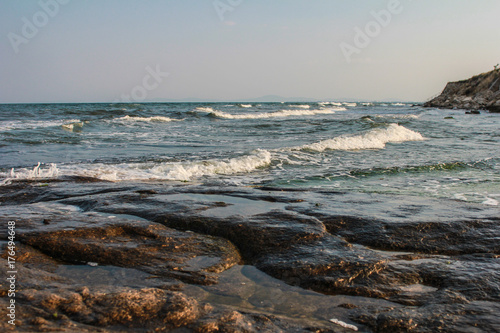 Waves on the beach of Ramla bay close-up photo
