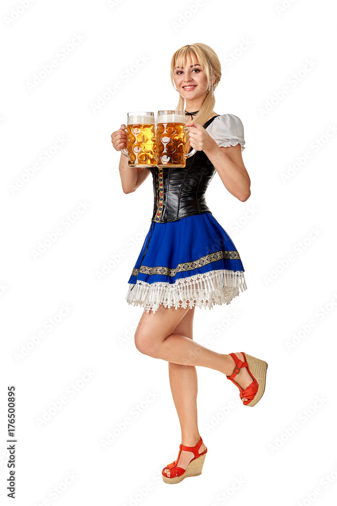 Full length portrait of a blond woman with traditional costume holding beer glasses isolated on white background. Full length portrait of a blond woman with traditional costume holding beer glasses isolated on white background.